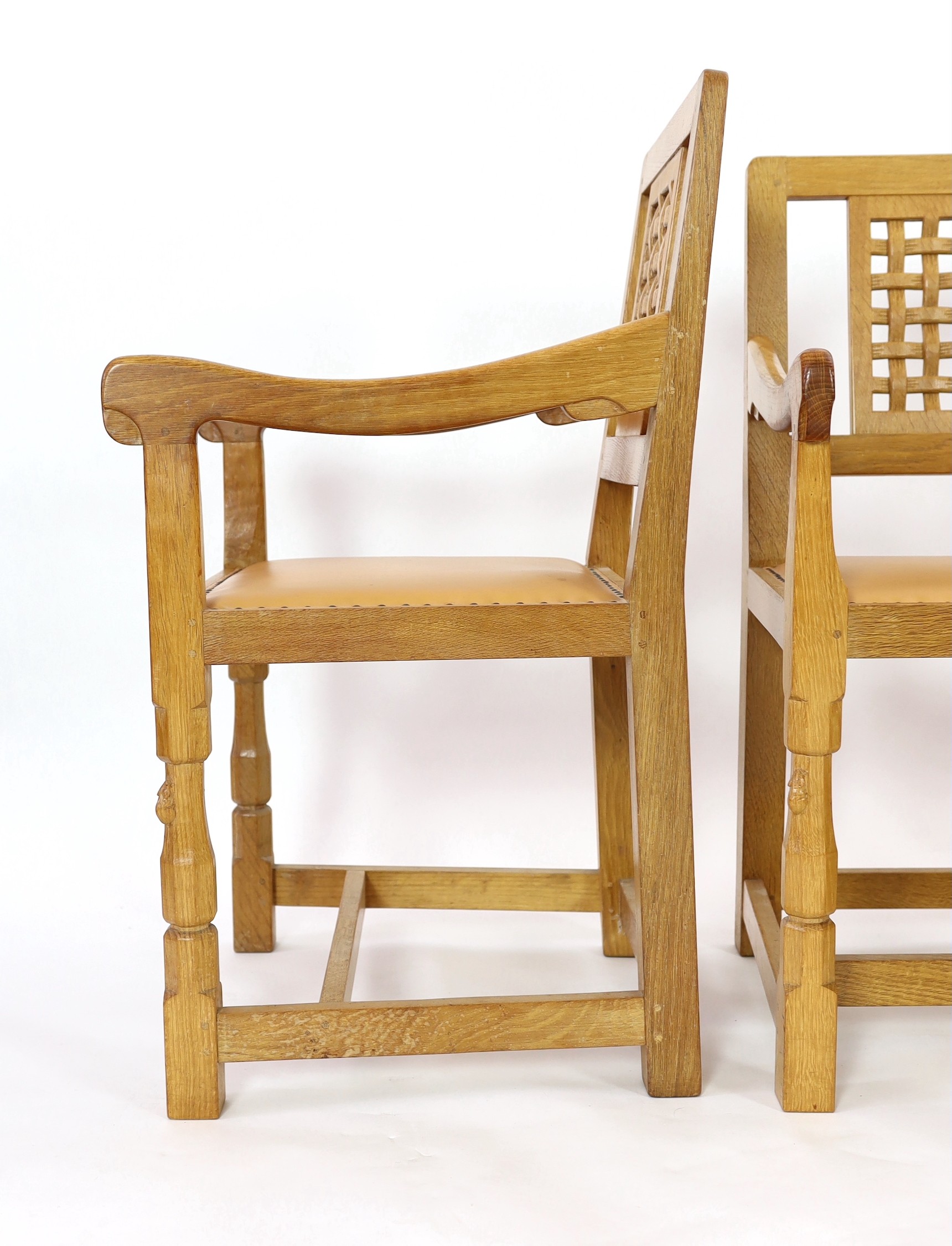 A set of four Robert Thompson 'Mouseman' oak armchairs W.52cm D.52cm H.90cm